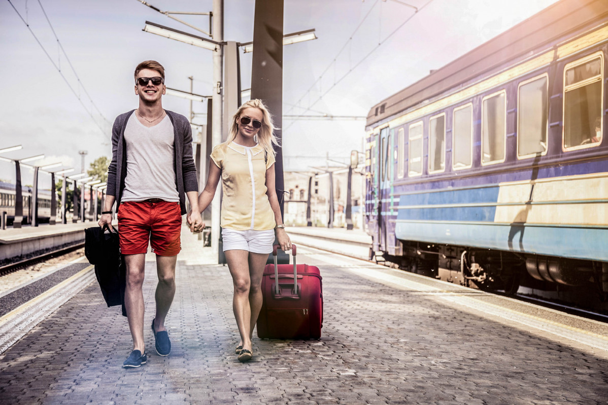 Young couple waiting for a train on platform iStock 000031131506 Large 2