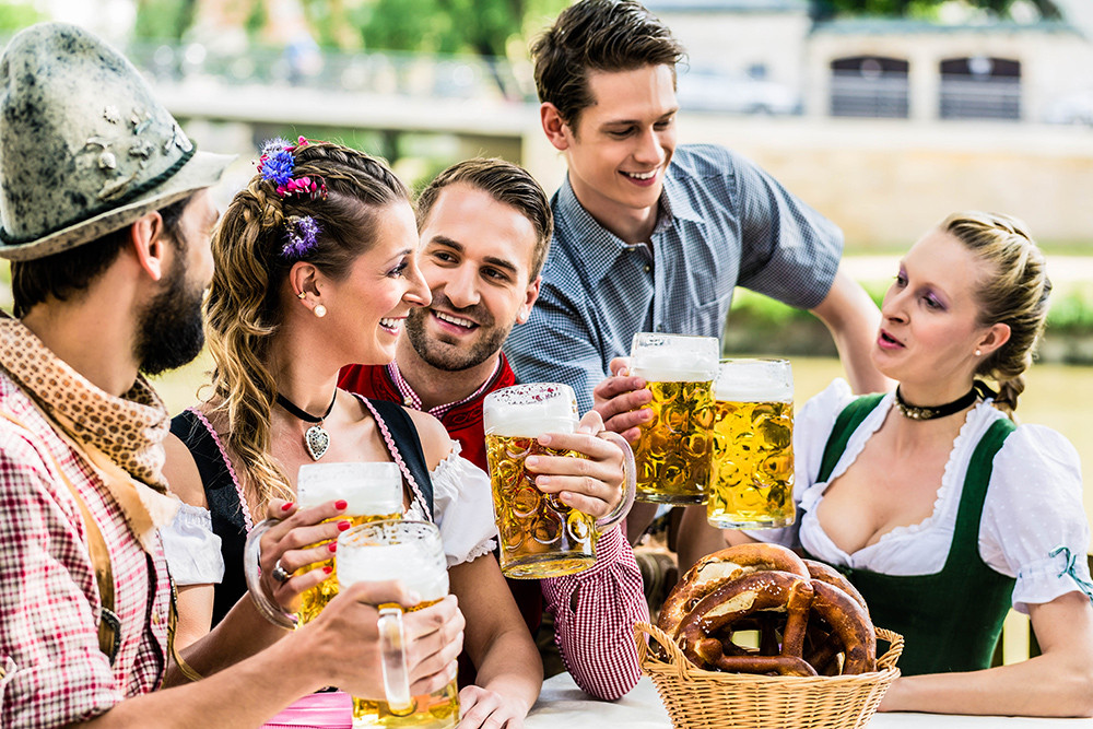 Friends in Bavarian beer garden drinking in summer shutterstock 316204055 2